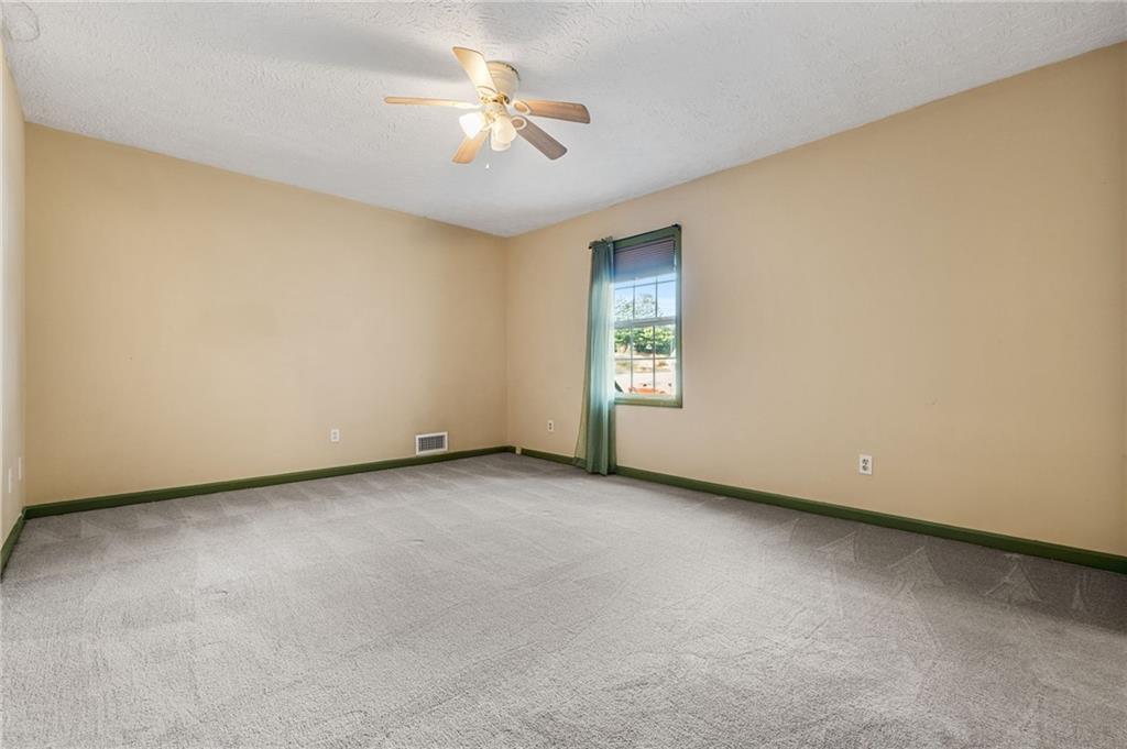805 Manning Way Southwest Marietta, GA 30064 - Photo 29 of 35 an empty room with a view of a house