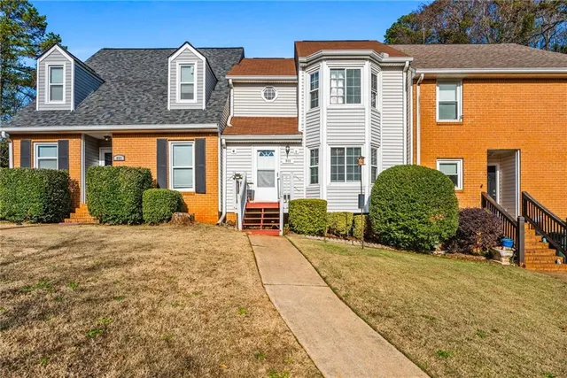 a front view of a house with a yard