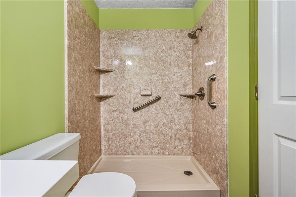 805 Manning Way Southwest Marietta, GA 30064 - Photo 33 of 35 a bathroom with a shower and toilet