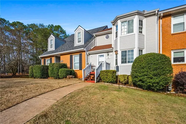 a front view of a house with a yard