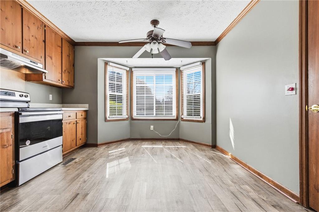 805 Manning Way Southwest Marietta, GA 30064 - Photo 8 of 27 a view of an empty room with a window and wooden floor