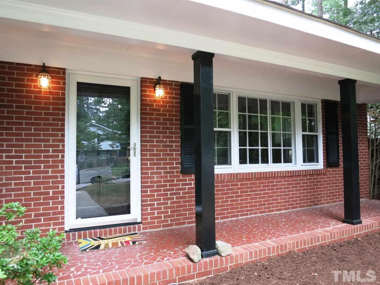 5201 Knollwood Road Raleigh, NC 27609 - Photo 2 of 25 Mostly brick exterior; lg covered rocking chair Front Porch. NEW roof 2013, NEW appliances, NEW Master Bath, Gas Pack 2011, water heater 2010!