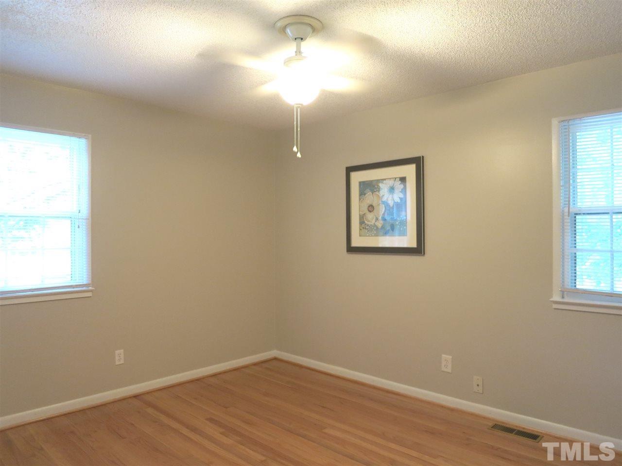 5201 Knollwood Road Raleigh, NC 27609 - Photo 18 of 25 There are 3 more spacious Bedrooms up here w/CF & lg closets. They share the hall Bath w/tiled floor, tiled tub/shower, mirrored medicine cabinet & Laundry closet w/wall cabinets. This is Bedroom 2.