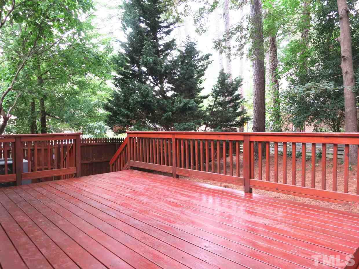5201 Knollwood Road Raleigh, NC 27609 - Photo 21 of 25 The lg Deck off the Kitchen overlooks the wooded & fenced backyard.