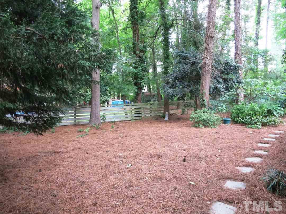 5201 Knollwood Road Raleigh, NC 27609 - Photo 22 of 25 The wooded & fenced backyard offers a lg Storage Shed.