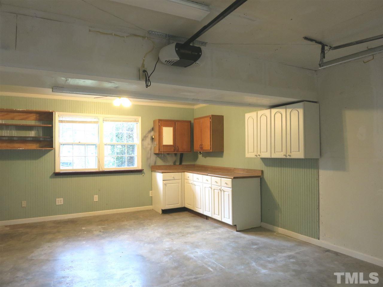 5201 Knollwood Road Raleigh, NC 27609 - Photo 24 of 25 View of the oversized 1-car rear-entry Garage w/cabinets.