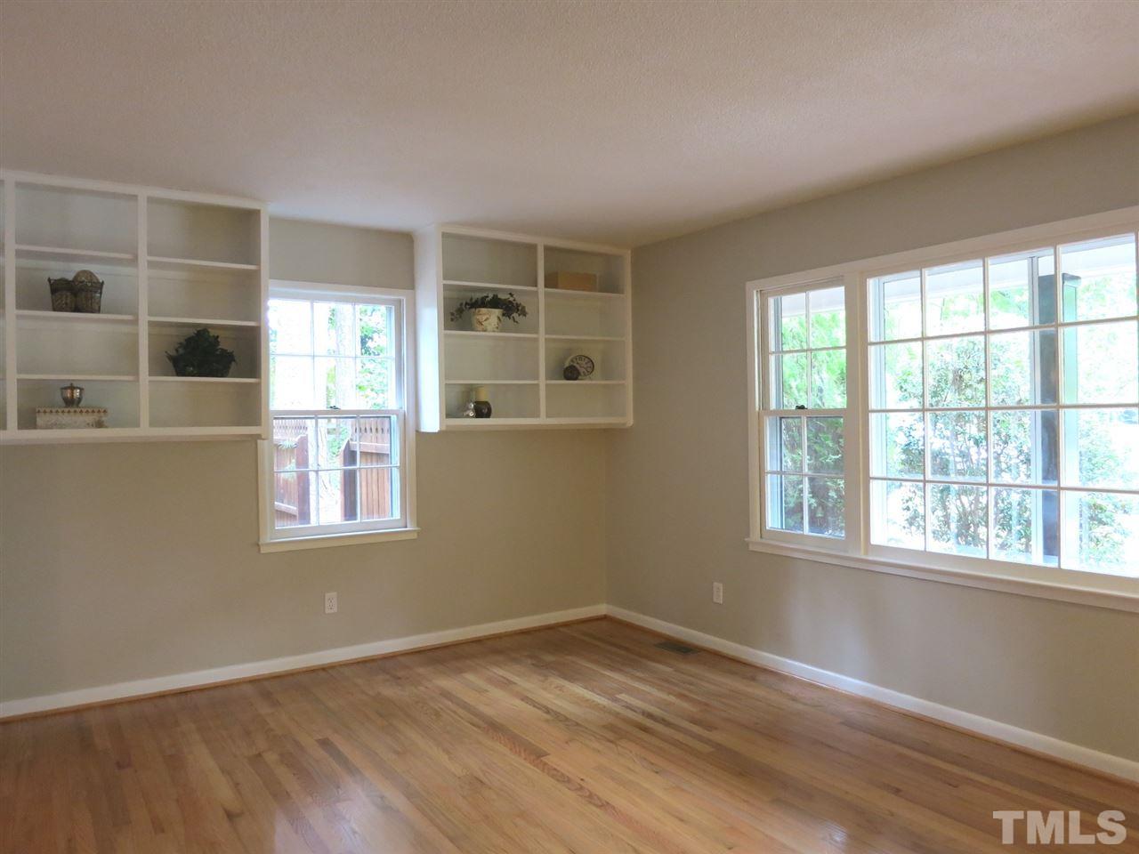 5201 Knollwood Road Raleigh, NC 27609 - Photo 4 of 25 The spacious Living Rm offers bookshelves & triple windows.