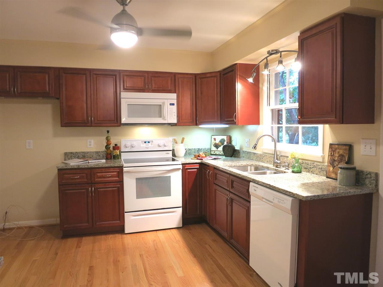5201 Knollwood Road Raleigh, NC 27609 - Photo 9 of 25 The updated Kitchen features lots of NEW cherry cabinets, granite counters, white smooth-top range, MW & DW, disposal, modern CF & track lighting & deep double bowl SS sink w/SS gooseneck faucet.