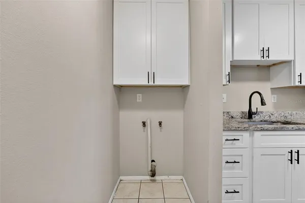 a kitchen with appliances cabinets and a sink