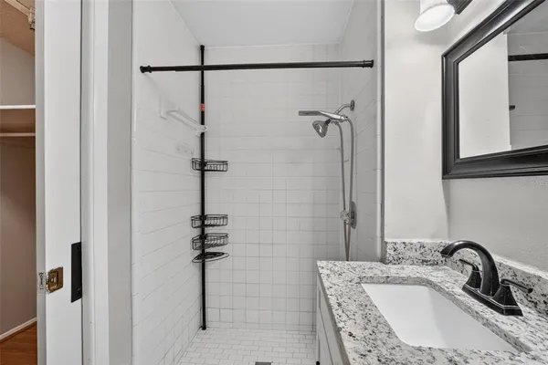 a bathroom with a sink and a mirror