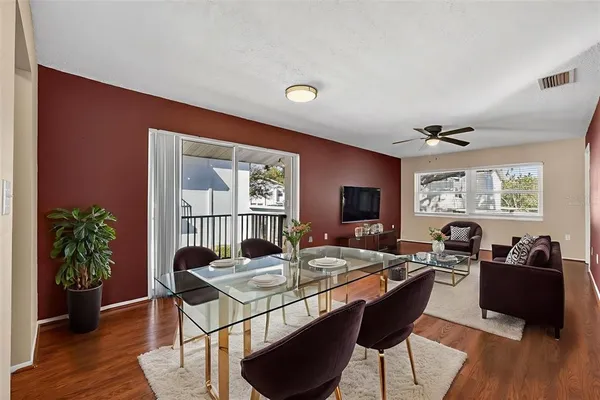 a view of a dining room with furniture window and wooden floor