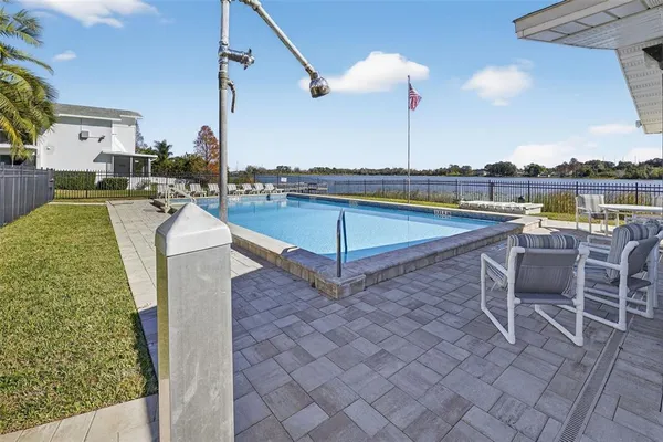 a view of a swimming pool with a lounge chairs