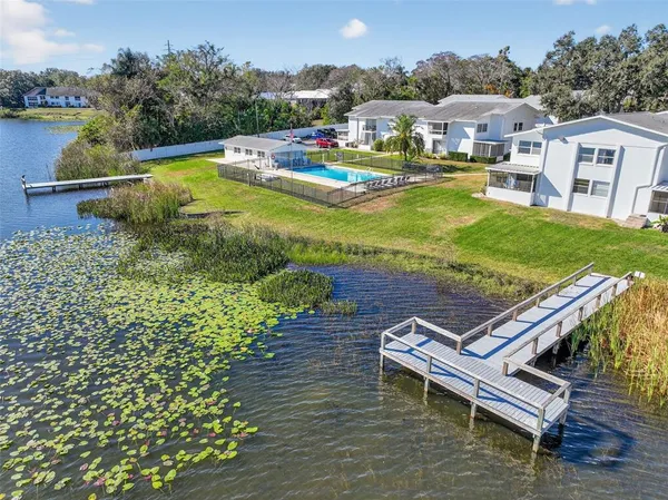 a view of a swimming pool with lounge chair