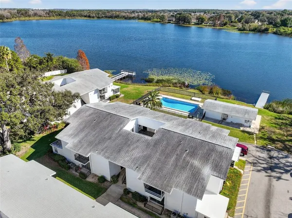 an aerial view of a house with a swimming pool