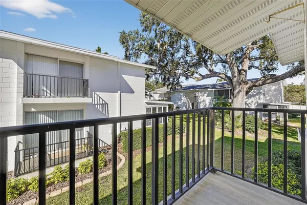 a view of a brick house with a large window