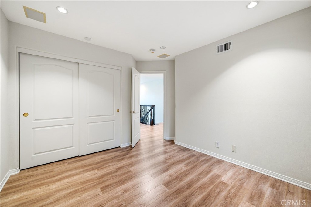 8082 Centerstone Drive Huntington Beach, CA 92646 - Photo 11 of 26 Bedroom 2 Upper level