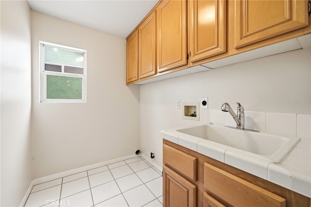 8082 Centerstone Drive Huntington Beach, CA 92646 - Photo 10 of 26 Laundry Room Upper Level