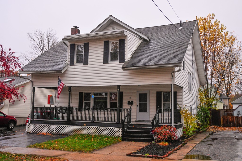 86 Osborne Terrace Springfield, MA 01104 - Photo 1 of 30 a front view of a house with a garden and plants