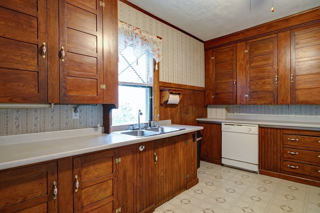86 Osborne Terrace Springfield, MA 01104 - Photo 11 of 30 a kitchen with stainless steel appliances granite countertop a sink stove and cabinets