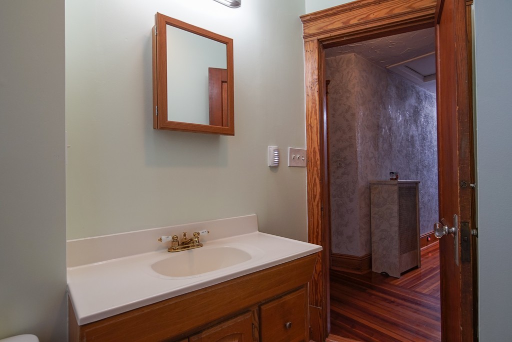 86 Osborne Terrace Springfield, MA 01104 - Photo 20 of 30 a bathroom with a sink and a mirror