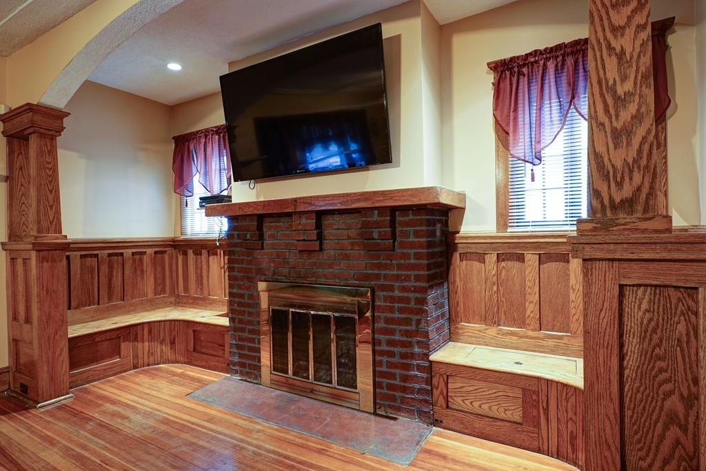 86 Osborne Terrace Springfield, MA 01104 - Photo 3 of 30 a living room with fireplace furniture and a flat screen tv