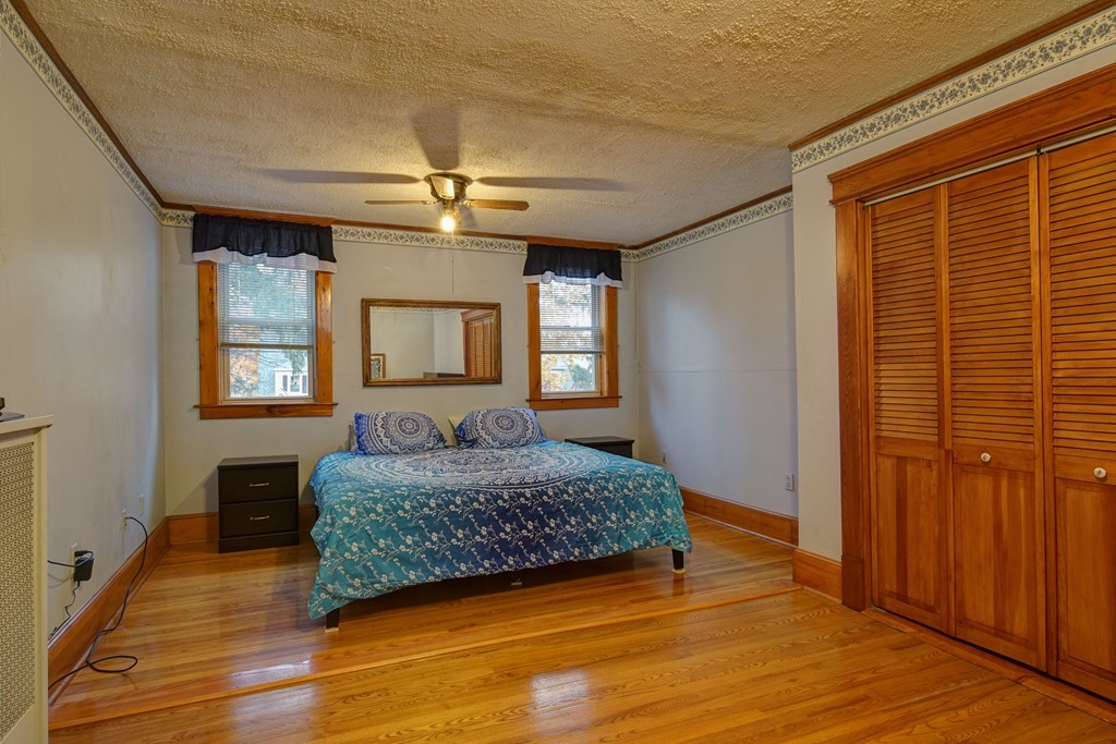 86 Osborne Terrace Springfield, MA 01104 - Photo 5 of 30 a living room with a bed furniture and a window