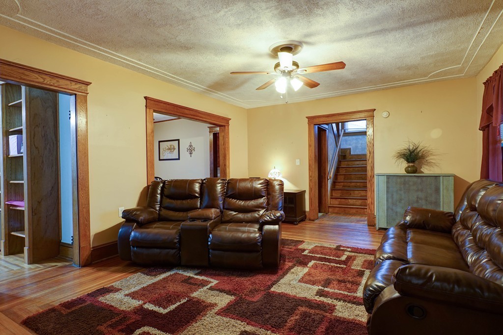 86 Osborne Terrace Springfield, MA 01104 - Photo 6 of 30 a living room with furniture and a chandelier