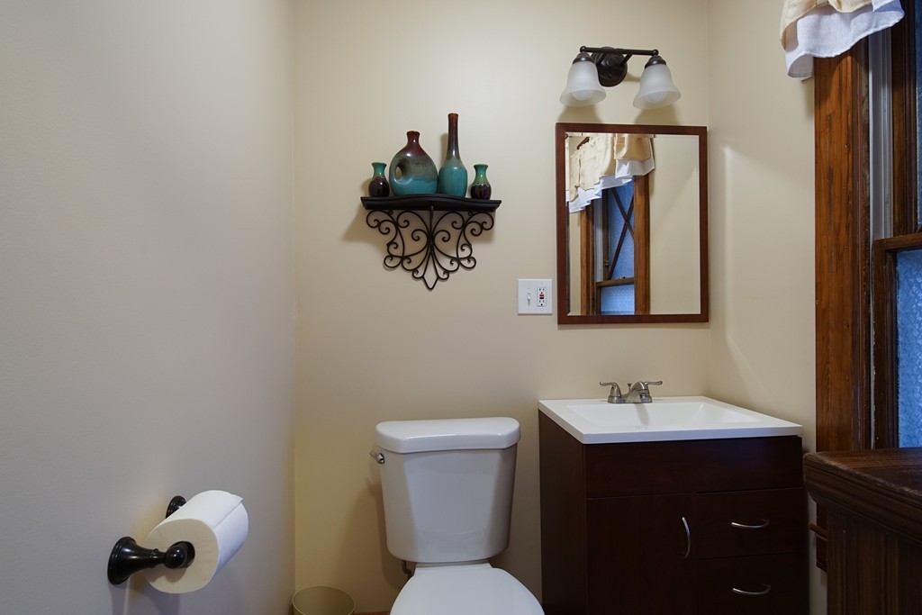 86 Osborne Terrace Springfield, MA 01104 - Photo 10 of 30 a bathroom with a toilet sink and mirror
