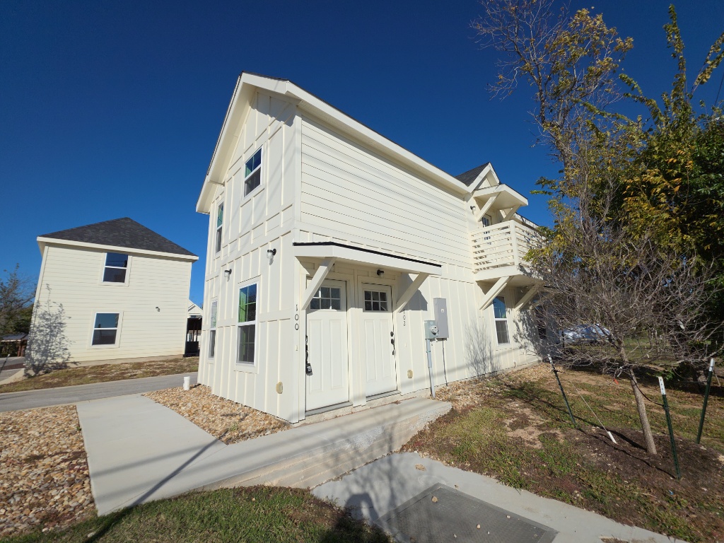 View of home's exterior with board and batten siding and a​​‌​​​​‌​​‌‌​‌‌​​‌​​​​‌​​​‌‌​‌‌‌ balcony