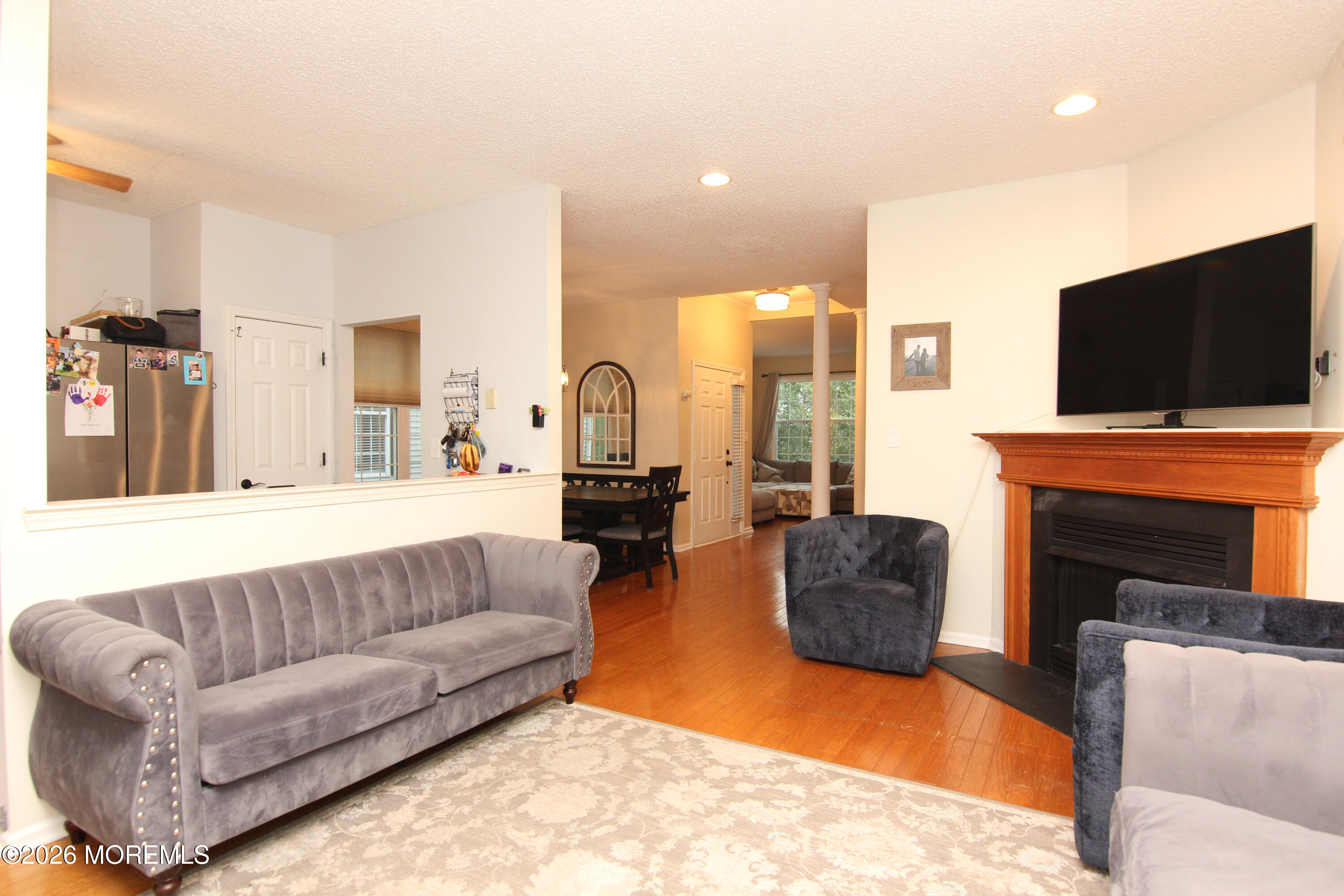 33 Austin Street Tinton Falls, NJ 07712 - Photo 1 of 46 a living room with fireplace furniture and a flat screen tv