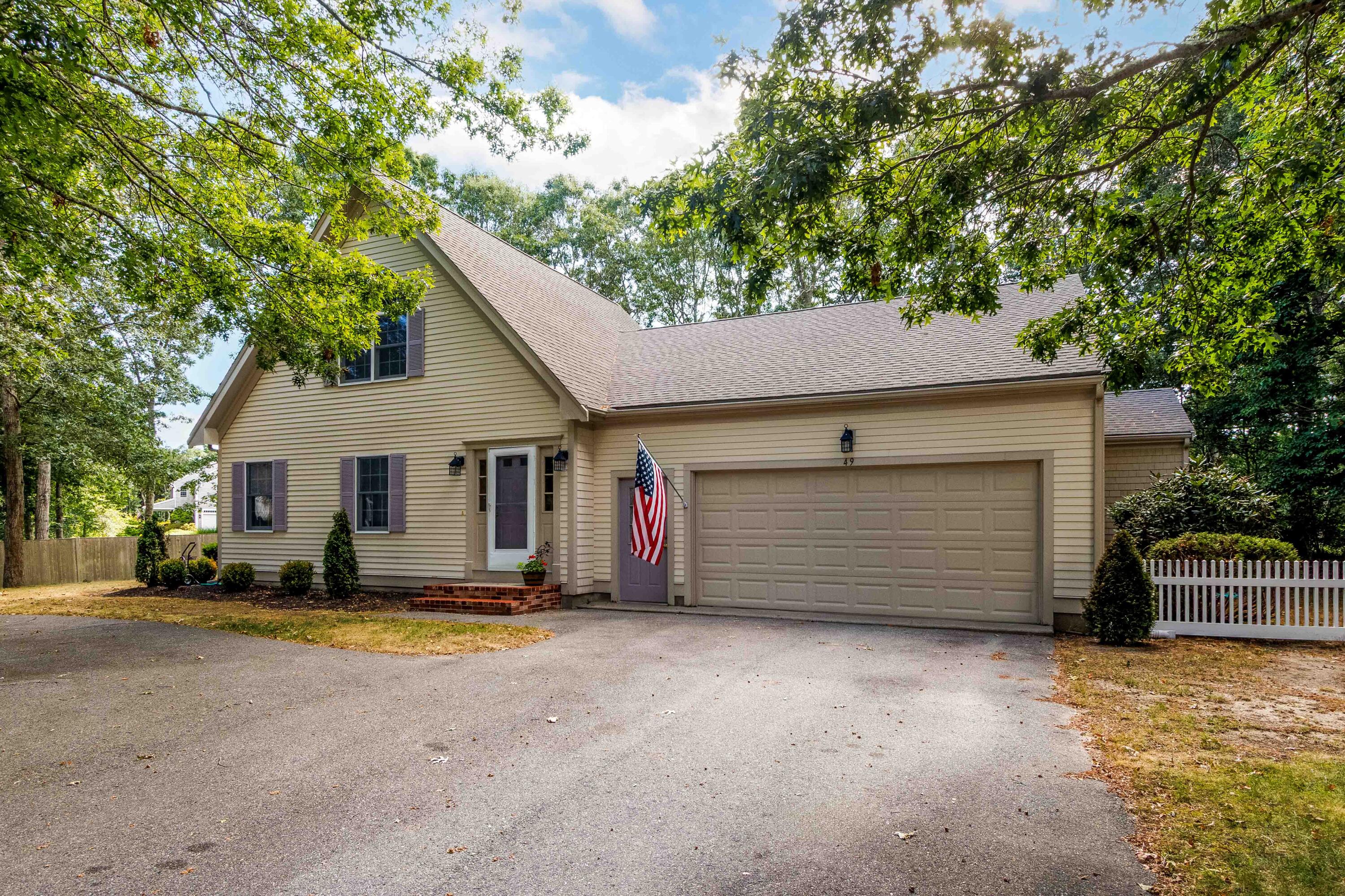 49 Rivers End Road East Falmouth, MA 02536 - Photo 23 of 32 a front view of a house with a garage