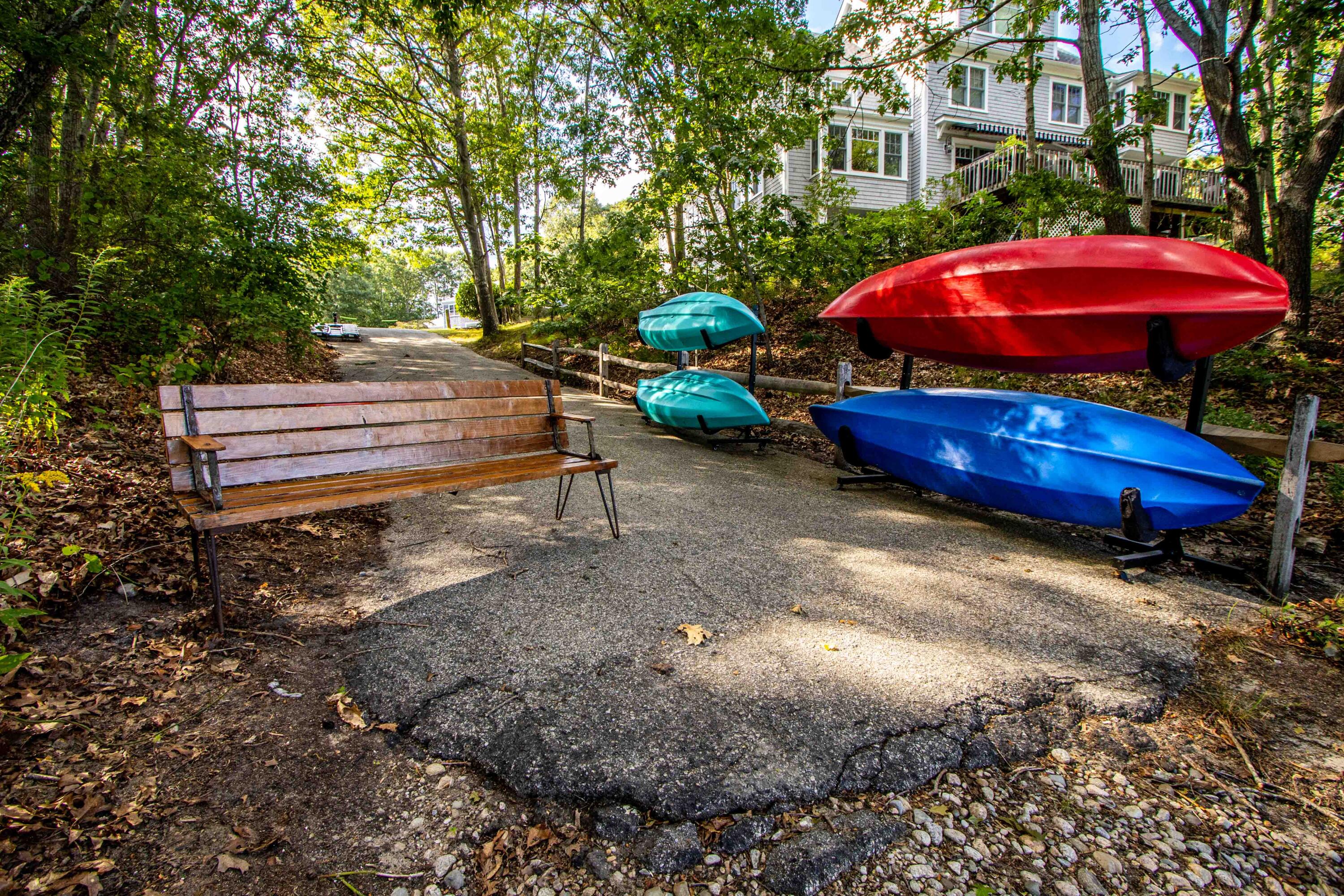 49 Rivers End Road East Falmouth, MA 02536 - Photo 31 of 32 a view of a backyard with a table and chairs under an umbrella