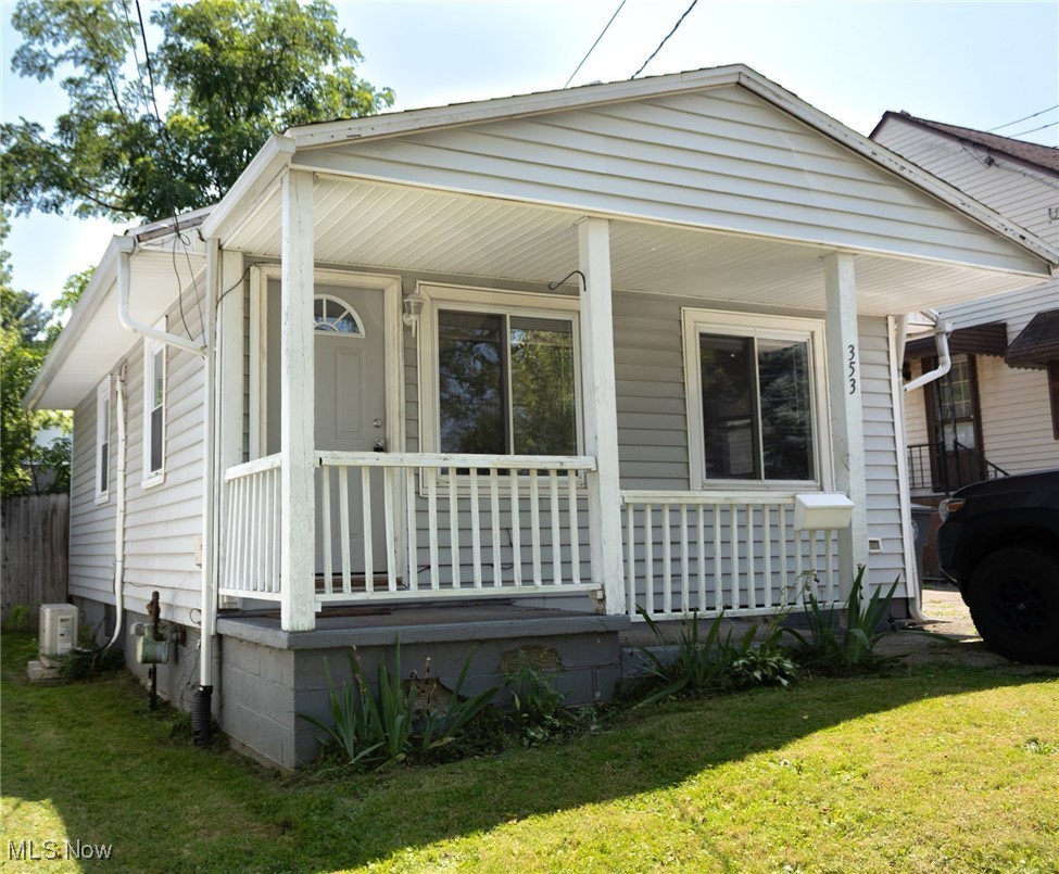 353 Gibbs Road Akron, OH 44312 - Photo 1 of 15 View of front of property with a porch and a front yard