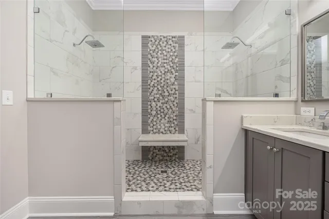 a bathroom with a double vanity sink a toilet and a shower