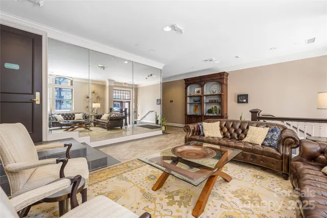 a view of living room with furniture and a fireplace