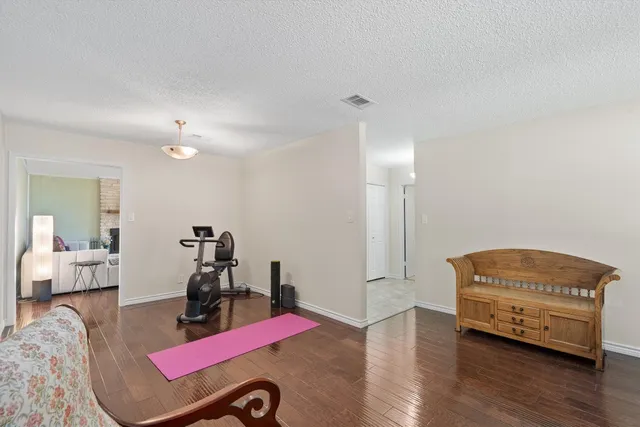 a room with furniture and wooden floor