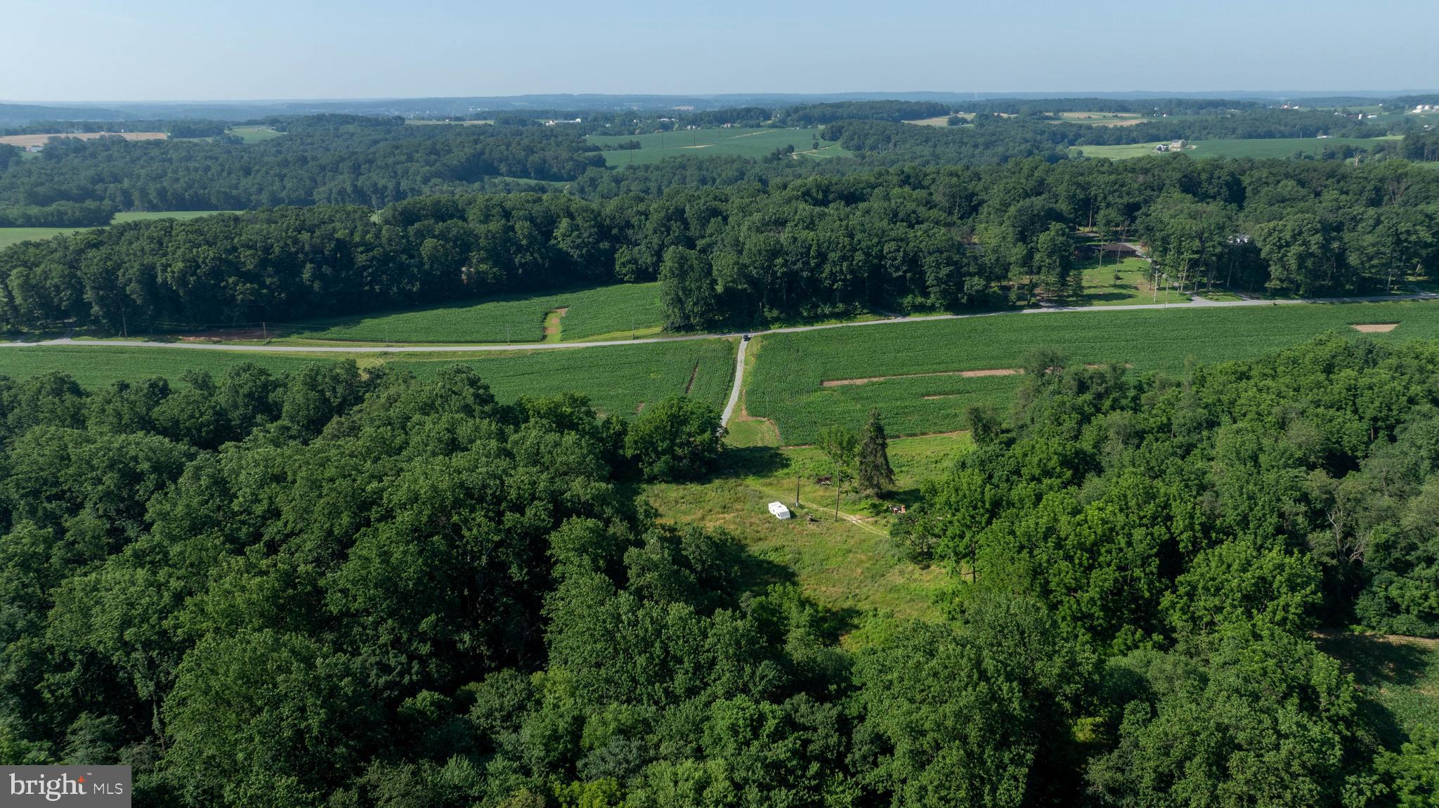 267 Cook Road Delta, PA 17314 - Photo 6 of 28 a view of a grassy field with trees