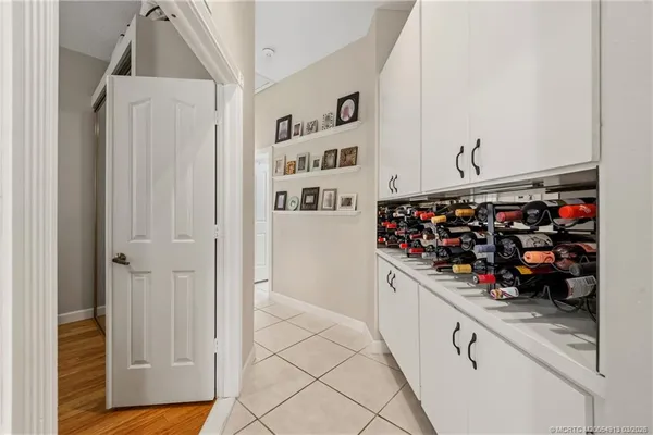 a kitchen with stainless steel appliances granite countertop a refrigerator and a stove