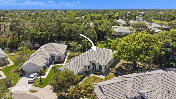 an aerial view of house with yard swimming pool and outdoor seating