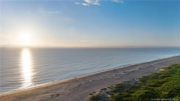 a view of a lake with beach and ocean view