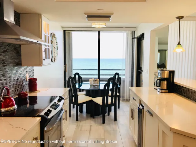 a view of a dining room with furniture and a window