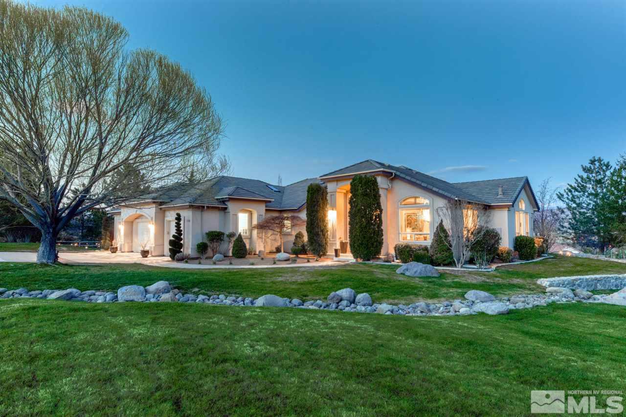 1352 Wolf Run Road Reno, NV 89511 - Photo 1 of 25 a front view of a house with a yard