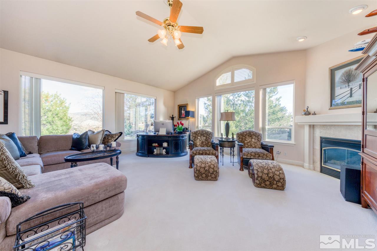 1352 Wolf Run Road Reno, NV 89511 - Photo 11 of 25 a living room with fireplace furniture and a large window