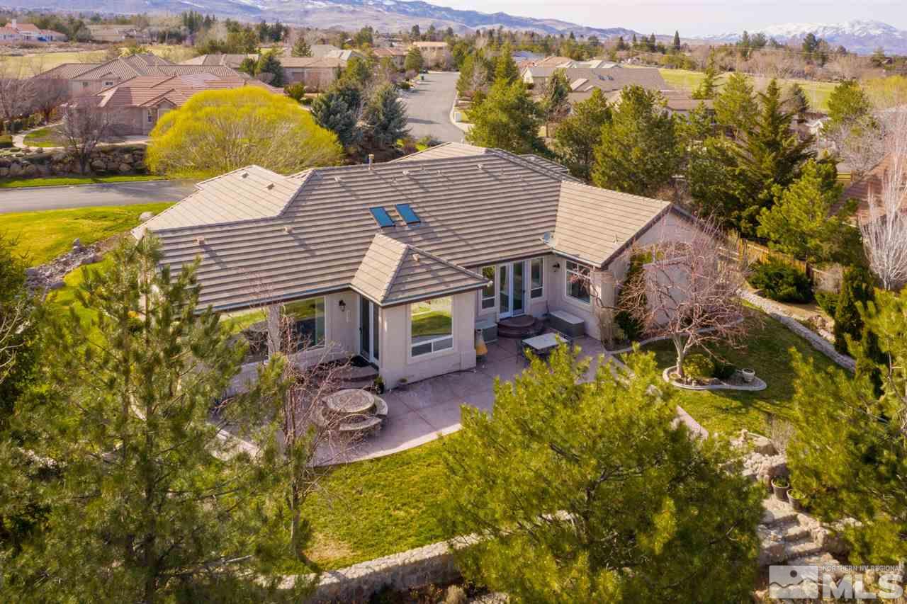 1352 Wolf Run Road Reno, NV 89511 - Photo 2 of 25 an aerial view of a house with swimming pool and green space