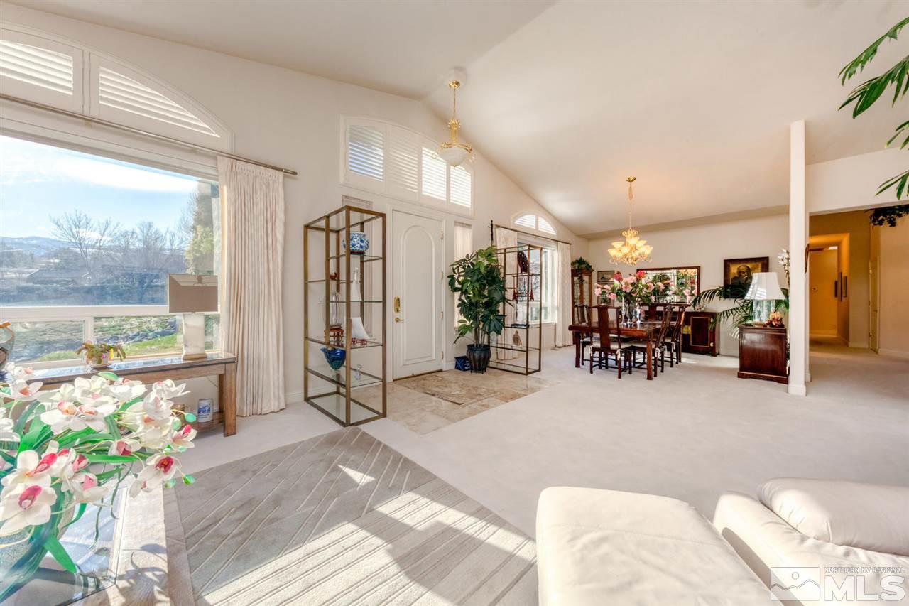 1352 Wolf Run Road Reno, NV 89511 - Photo 10 of 25 a view of a livingroom with furniture and a floor to ceiling window
