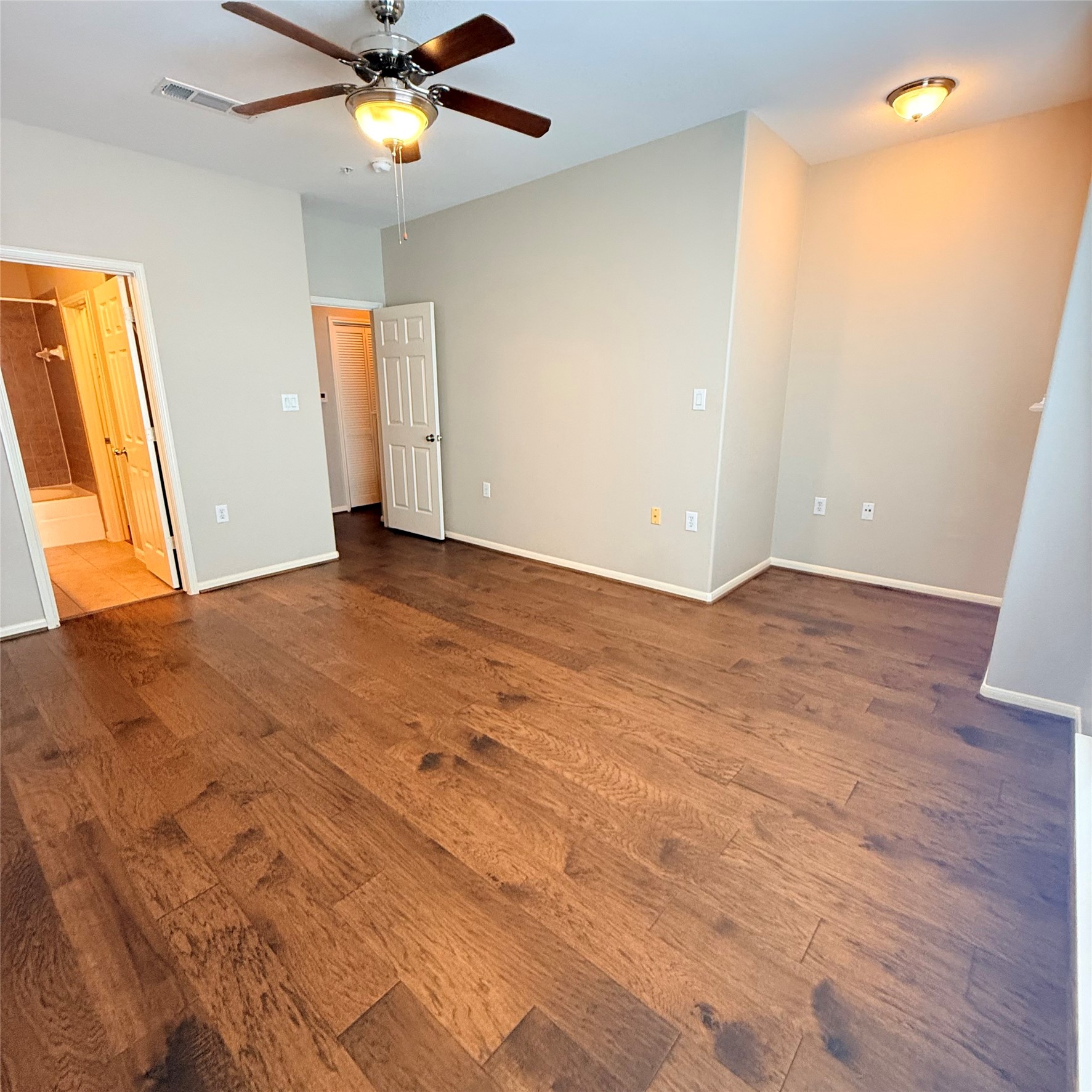 9200 Westheimer Road, Unit 304 Houston, TX 77063 - Photo 12 of 24 wooden floor in an empty room with a window