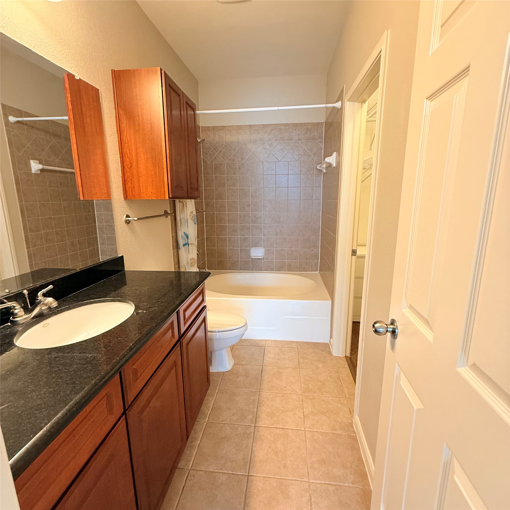 9200 Westheimer Road, Unit 304 Houston, TX 77063 - Photo 16 of 24 a bathroom with a bathtub a sink and a shower