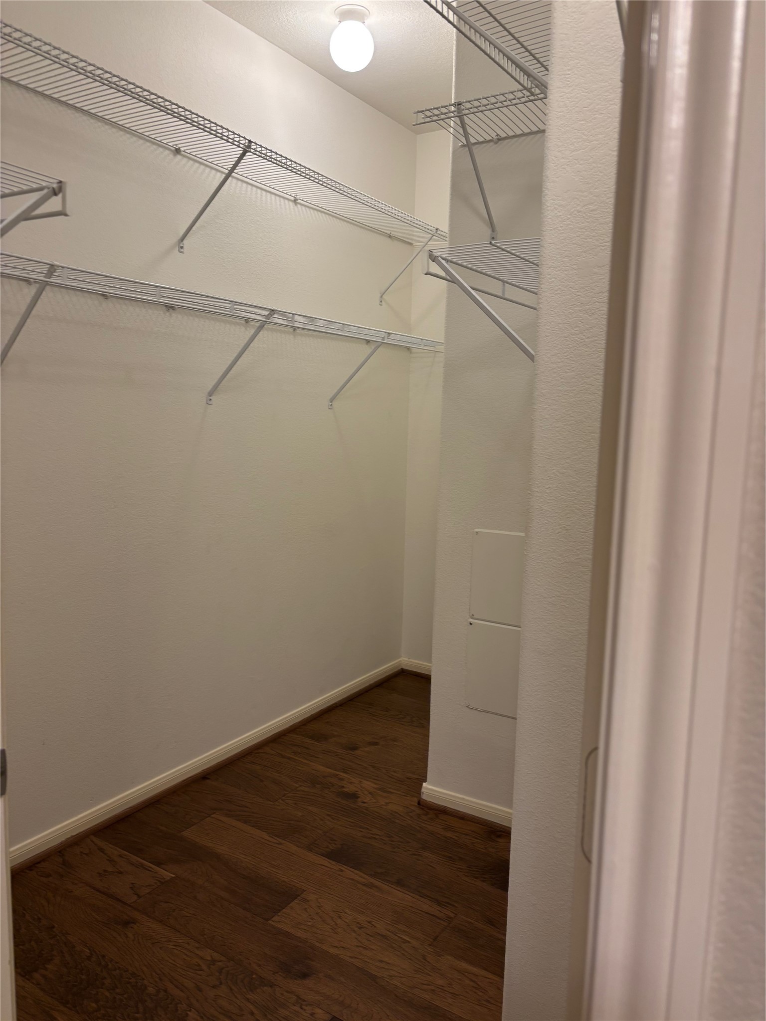 9200 Westheimer Road, Unit 304 Houston, TX 77063 - Photo 19 of 24 a view of a room with wooden floor and cabinet