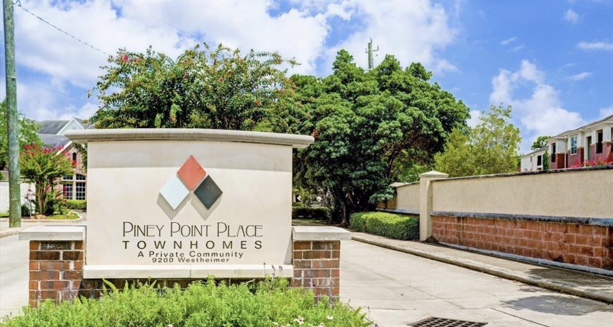 9200 Westheimer Road, Unit 304 Houston, TX 77063 - Photo 21 of 24 a sign on the side of a building