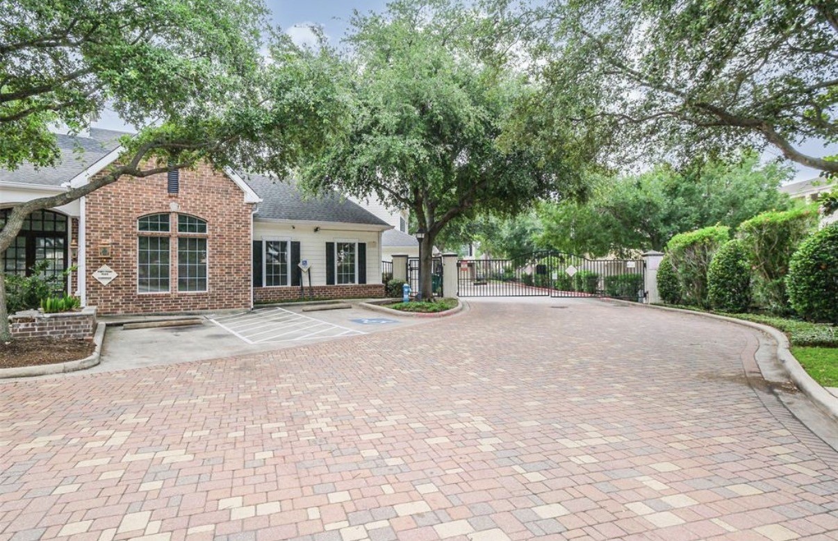 9200 Westheimer Road, Unit 304 Houston, TX 77063 - Photo 22 of 24 a front view of a house with a garden